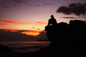 moment of fulfillment watching sunset over sea