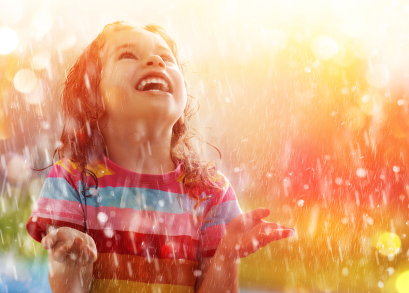 child in rain experiencing the power of grace