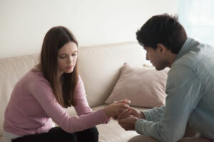 man showing love and compassion towards woman