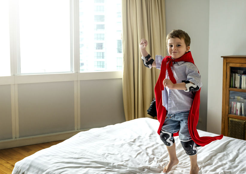 boy playing superhero