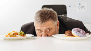 man using his willpower to decide what to eat