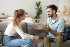 couple face to face resolving conflict