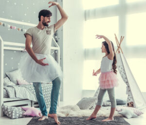 Dad and daughter playing ballerina