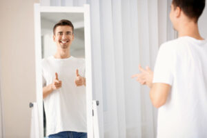 man looking in mirror