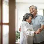 older couple dancing and smiling