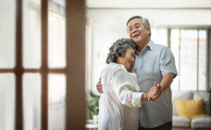 Older couple dancing joyfully because they have overcome the myths of marriage