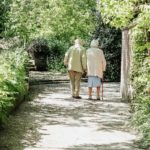 older couple walking hand in hand