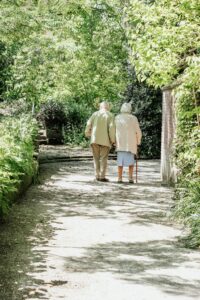 older couple walking hand in hand