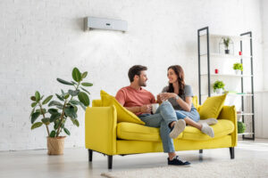 happy couple sitting on couch communicating