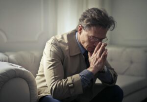 man alone on couch